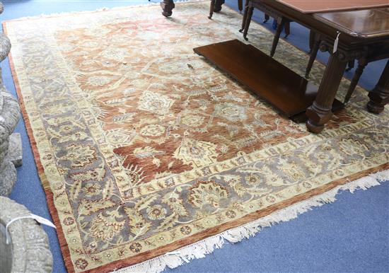 A Persian style tan ground carpet 306cm x 250cm